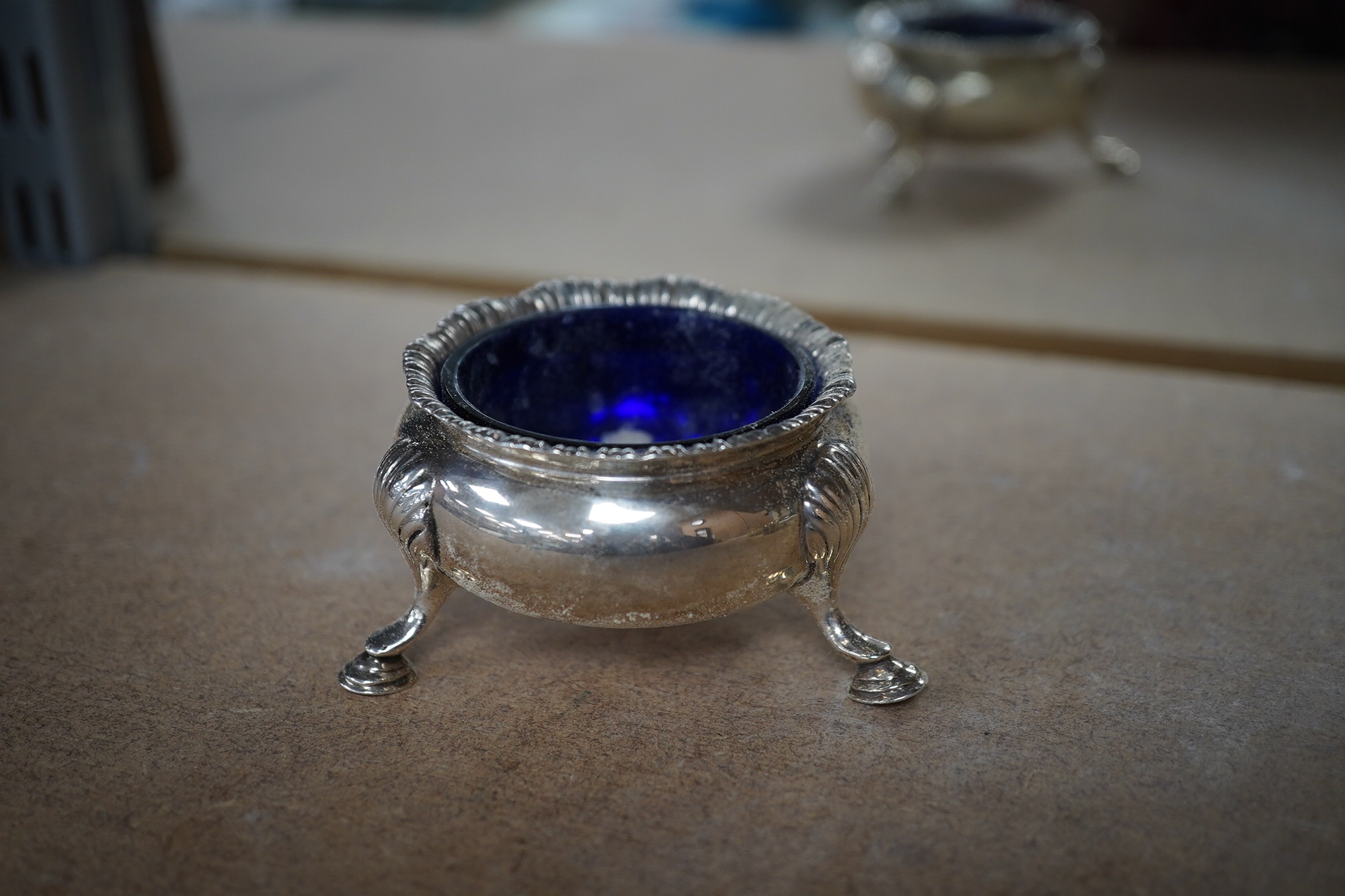 Sundry small silver including a pair of Edwardian pierced bonbon dishes, Chester, 1906, diameter 11cm, pair of Scottish bun salts, five other condiments, three napkin rings, two spoons, a bowl, toast rack, whistle match